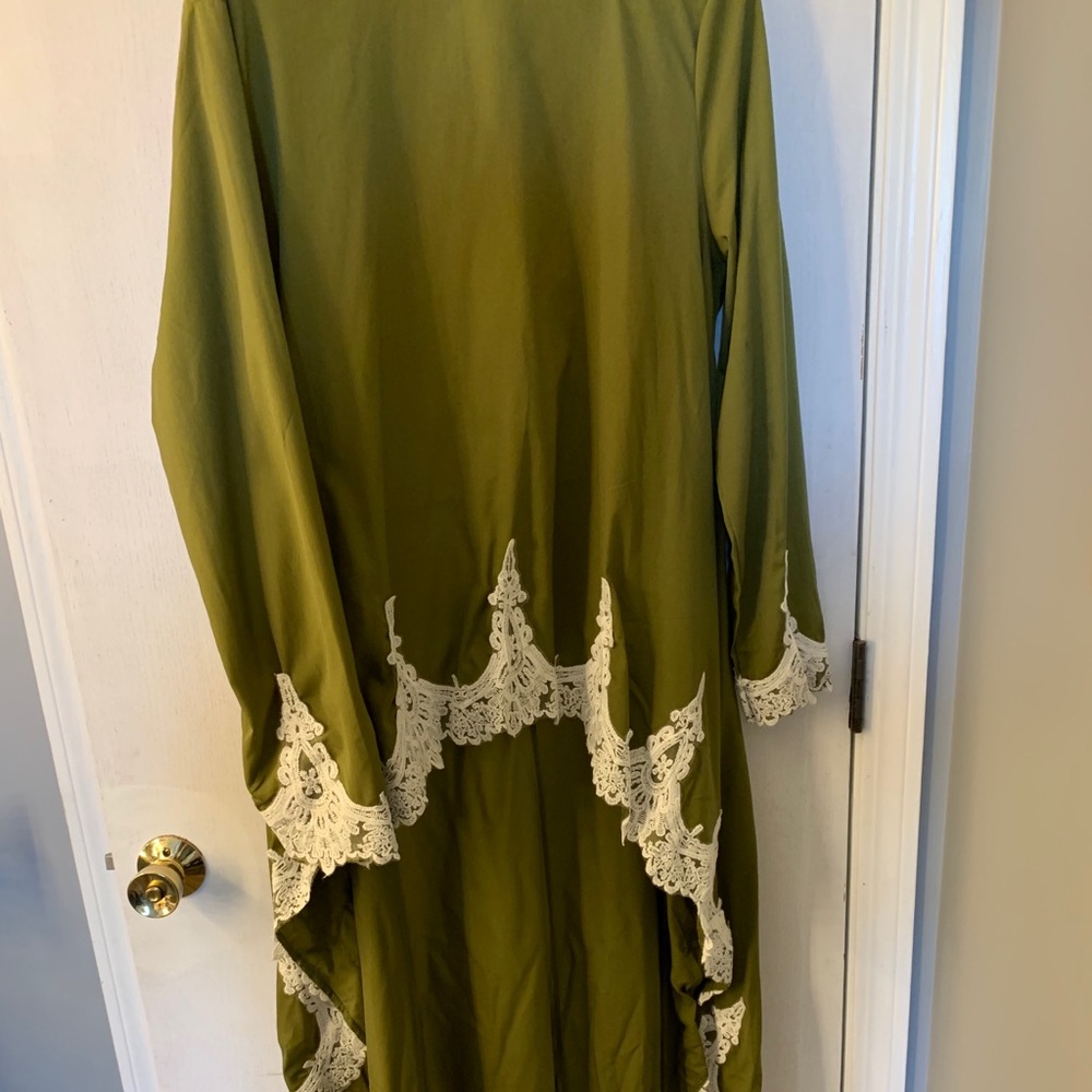 Green and white blouse longer from back